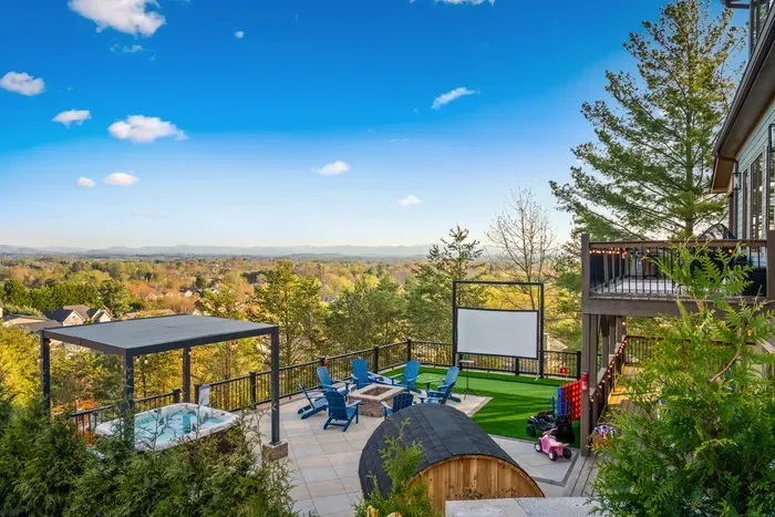 Hot tub, fire pit, sauna, putting green, projector for movie night. The whole backyard built for the kind of long mountain evening that's the real reason you came up here.