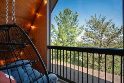 Claim the screened balcony when the house gets busy. Swing chair, tree view, and a little distance from the action without disappearing from the trip.