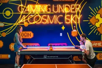 Three generations crowded around the air hockey, the puck flying, everyone yelling. The kind of game-room moment that ends up the actual highlight of the whole week.
