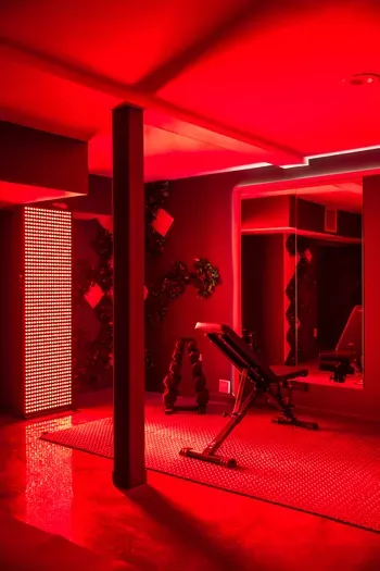 The quiet lift before the house wakes up. Bench, weights, mood lighting set low, the kind of session that earns the slow porch coffee and the easy walk to the kitchen right after.