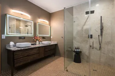 Two sinks means zero standoff when the whole crew is racing to make a downtown dinner reservation. Hot shower, plush towel, robe on the hook, out the door.