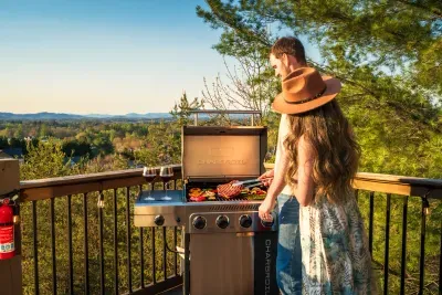 Grill night under the lights, mountain hush at your back, dinner stretching long into the evening. The kind of cookout that turns into the trip's best memory before anyone notices.