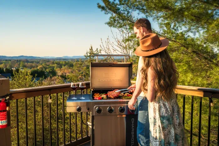 Grill night under the lights, mountain hush at your back, dinner stretching long into the evening. The kind of cookout that turns into the trip's best memory before anyone notices.