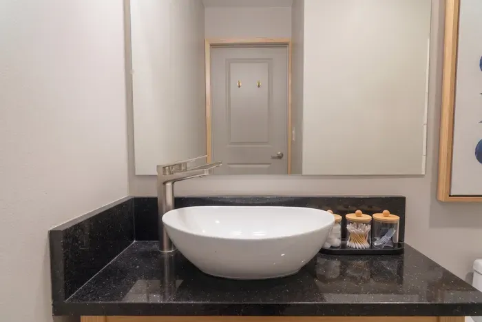 A separate vanity keeps the morning moving. Brush teeth, fix hair, stash the little things, and get back to the group before plans change again.
