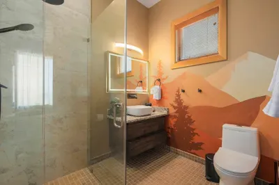 Asheville stays generous with mud, and this shower is built for it. Step in with trail dust on your boots, step out ready to meet the group for late breakfast.