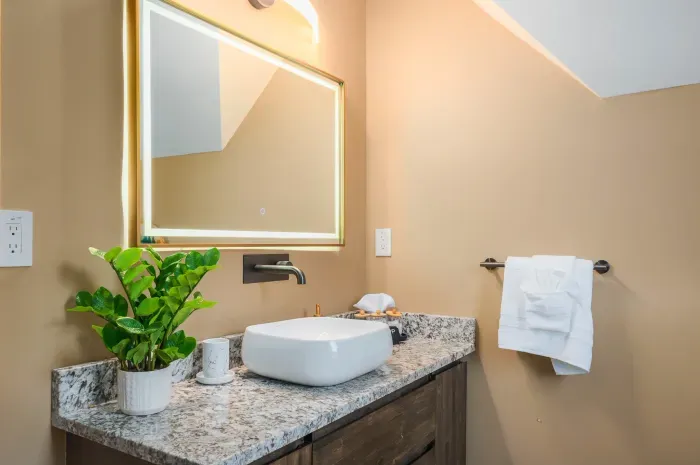 Soft mirror light for the unhurried morning routine. Brush, rinse, gather yourself, then drift downstairs to whichever housemate already has the coffee going.