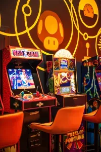 Retro arcade game room with classic machines and bold, colorful vibes