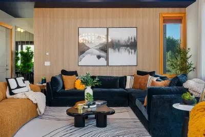 Designer living room with plush sectional, art wall, and cozy modern style