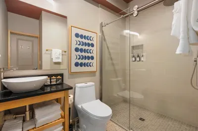 Rainfall overhead, hot water on tap, the kind of post-hike rinse that earns the rest of your evening. Plush towel and fresh soap ready when you're done.