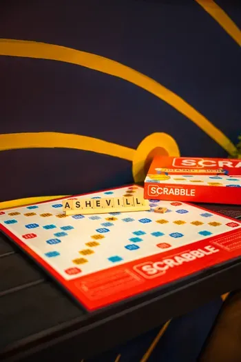 Board games handle the quieter side of game night. Pull up a chair, spell out the city you came for, and let the room slow down for a minute.