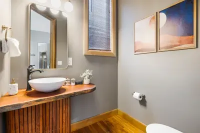 The quick pit stop on the main floor that somehow ends up in the group chat. A handy spot for guests during dinner parties without sending anyone upstairs.