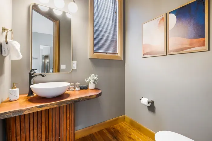The quick pit stop on the main floor that somehow ends up in the group chat. A handy spot for guests during dinner parties without sending anyone upstairs.