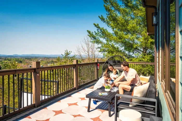Sink into the egg chair on the covered deck, coffee in hand, the valley stretching out past the rail toward the Blue Ridge. The slow morning the rest of the trip gets built around.