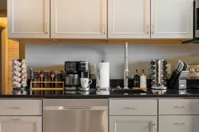 The second kitchen handles breakfast for the lower-level guests without bumping into anyone upstairs. Two full kitchens is why this house holds twenty without friction.