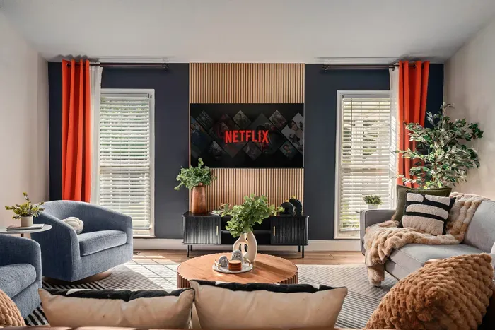 Bright modern lounge with Netflix, cozy seating, and stylish design