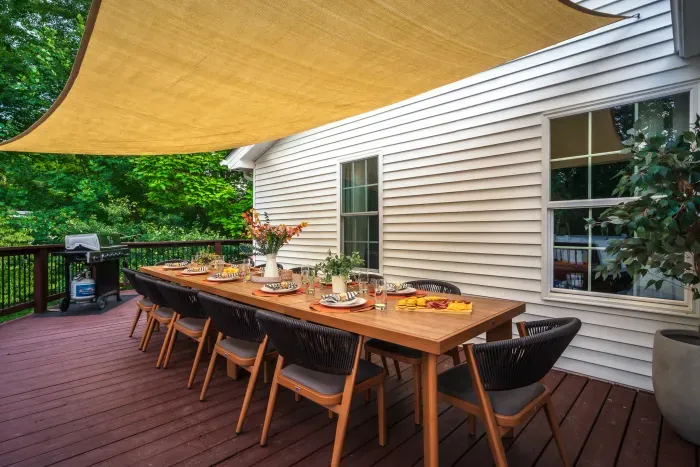 Spacious shaded deck with outdoor dining for memorable group meals