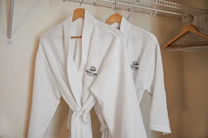 Plush branded robes add a cozy, boutique touch to your stay