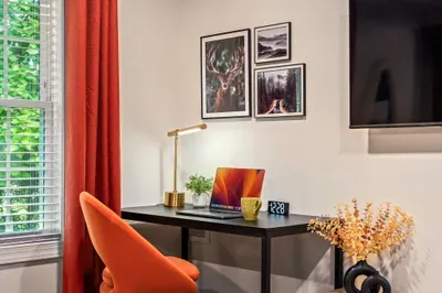 Bright, stylish workspace with window views and cozy modern decor