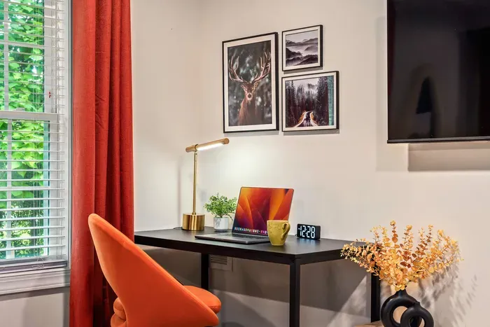 Bright, stylish workspace with window views and cozy modern decor