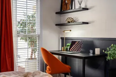 Bright, modern workspace with natural light and a bold accent chair