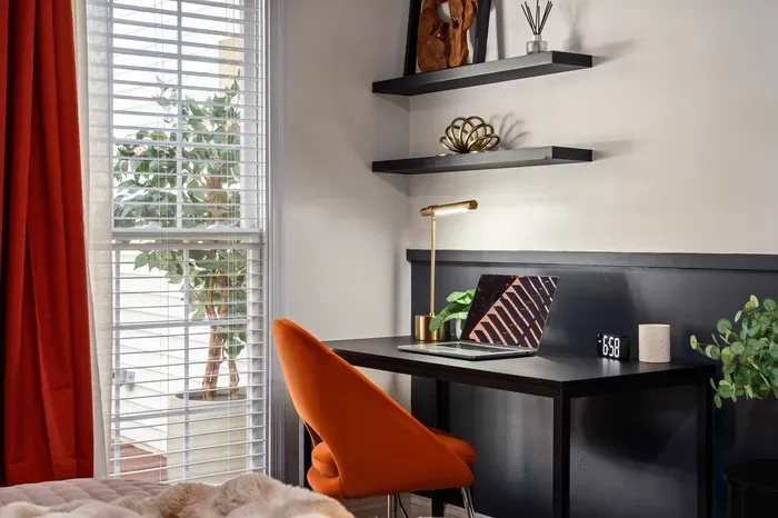 Bright, modern workspace with natural light and a bold accent chair