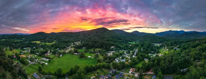 Breathtaking mountain valley views under a vibrant sunset sky