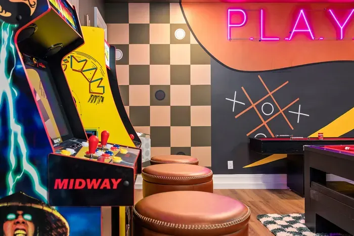 Retro arcade game room with neon vibes and fun for all ages