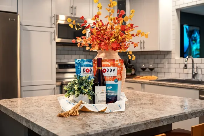 Bright modern kitchen with spacious island and thoughtful welcome treats