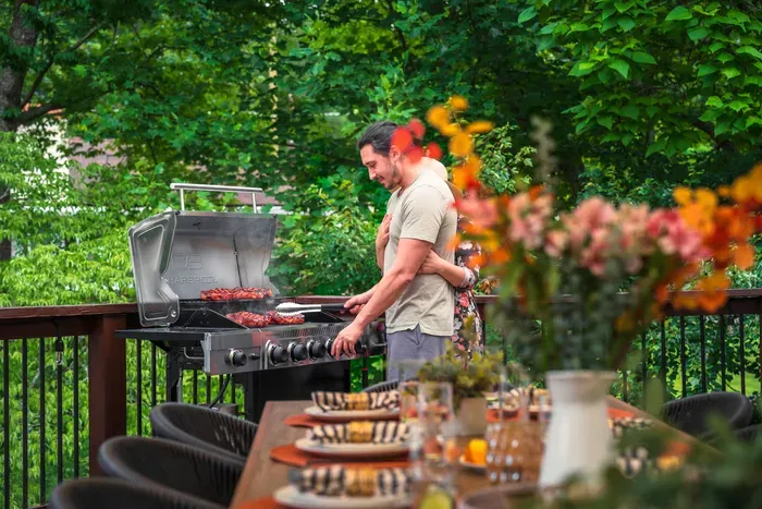 Private wooded deck with grill and outdoor dining for memorable evenings