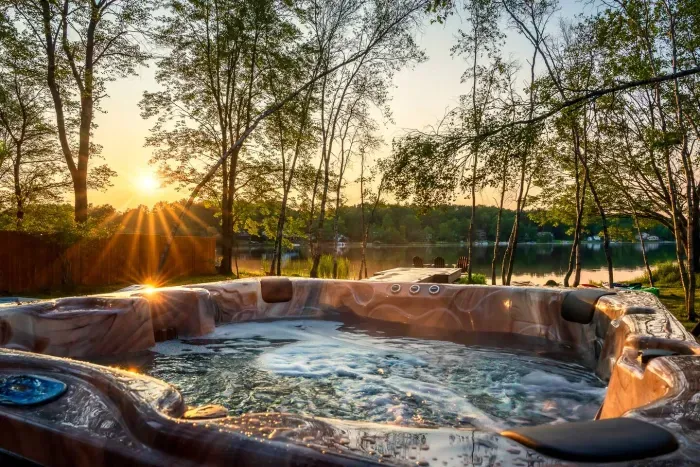 End your day in pure bliss — soak in the warm jets of your private hot tub as the sun dips below the lake horizon.