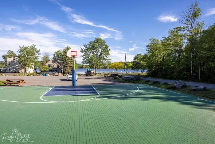 Enjoy some friendly competition or solo practice on the outdoor basketball court—just steps from the lake and close to Moonlit Peak. The perfect spot for active moments between your cozy fireside nights.