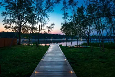 Evenings at Moonlit Peak are unforgettable — stroll down the softly lit dock and unwind as the lake reflects the colors of twilight.