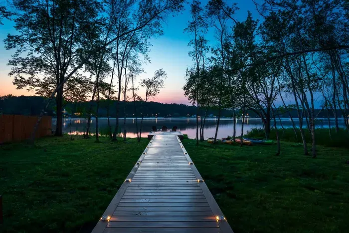 Evenings at Moonlit Peak are unforgettable — stroll down the softly lit dock and unwind as the lake reflects the colors of twilight.