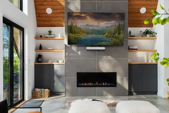 Enjoy cozy nights by the sleek gas fireplace with a movie on the big screen and Sonos surround sound filling the space. Thoughtful design and luxe textures make this the perfect place to unwind in style.