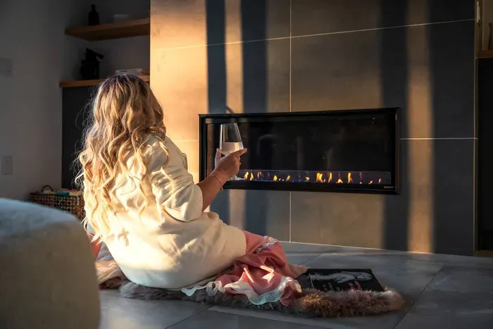 Unwind by the modern fireplace with a glass of wine or a good book. The perfect spot to slow down, soak in the views, and let the peaceful vibe of Moonlit Peak surround you.