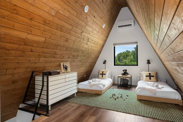 This flexible sleeping space is located right next to the loft lounge and PS4 area, making it a fun and convenient hangout spot.