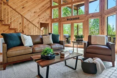 Stretch out, relax, and enjoy nature through the tall windows.