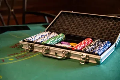 Poker table with a full chip set ready to go. The game room becomes a card room the moment the sun drops.