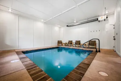 Private indoor pool with lounge seating and easy-entry steps. Kids stay busy for hours; the adults get the deck to themselves.