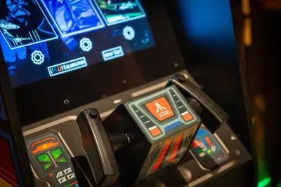 Retro arcade cabinet set to free play. An hour disappears in here and nobody minds.