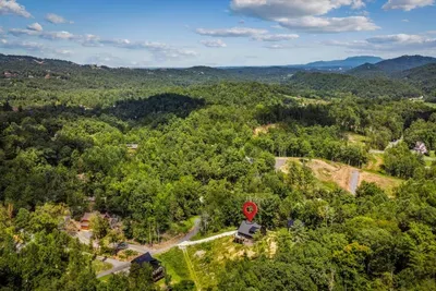 Rolling mountain country in every direction, with your cabin sitting right in the middle of it. Trailheads and town both close, neither one crowding you.