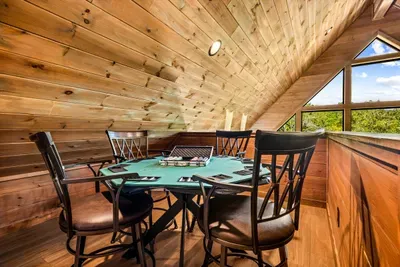 Felt-topped poker table in its own upstairs nook. Deal everybody in — the mountains aren't going anywhere.