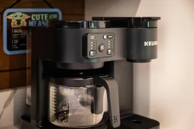 Dual coffee bar — brew a single cup or a full pot before the house wakes up. Carry it out to the deck and watch the fog lift off the ridge.