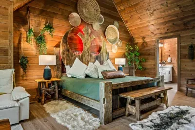 King suite with attached bath and forest views — the room the grown-ups call dibs on before the bags are inside.