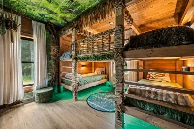 Built-in bunks, forest murals, and windows looking at the real thing. Kids claim this room before the car is even unloaded.