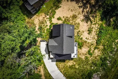 Private drive, private lot, no neighbors in your sightline. This cabin sits on its own pocket of forest with parking for the whole caravan.