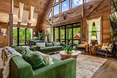 Deep velvet sectional, a wall of glass, and forest as far as you can see. Claim your corner early, because this seat goes fast.