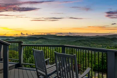 Golden hour from the deck rail, a chair already waiting