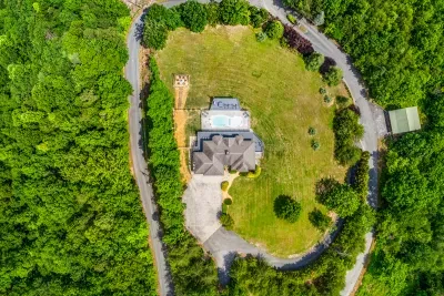 Circle drive, wide lawn, forest wrapped around it