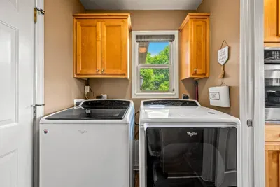 Laundry with a door that closes, pool towels handled